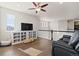 Bonus room with hardwood floors, black railing, and cozy seating area at 3745 Spanish Oaks Trl, Castle Rock, CO 80108