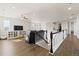 Upstairs bonus room with railing, storage, hardwood floors and lots of light at 3745 Spanish Oaks Trl, Castle Rock, CO 80108