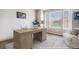 Bright home office with a large window, desk, and comfortable seating area at 3745 Spanish Oaks Trl, Castle Rock, CO 80108