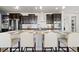 Kitchen island with bar seating and granite countertops at 3745 Spanish Oaks Trl, Castle Rock, CO 80108