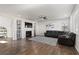 Bright living room features a fireplace, built-in shelves, and hardwood floors at 3745 Spanish Oaks Trl, Castle Rock, CO 80108