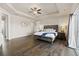 Spacious main bedroom with tray ceilings, hardwood floors, and a sliding door to the outside at 3745 Spanish Oaks Trl, Castle Rock, CO 80108