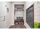 Mud room with built-in bench, storage, and a chalkboard at 3745 Spanish Oaks Trl, Castle Rock, CO 80108