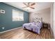 Bedroom featuring vinyl floors, standard closet, and window at 11761 Lewiston St, Commerce City, CO 80022