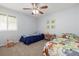 Charming bedroom with ceiling fan, two twin beds, and whimsical animal artwork at 11761 Lewiston St, Commerce City, CO 80022