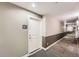 Condo hallway, apartment 309, with carpeted floors and gray color scheme at 9079 E Panorama Cir # 309, Englewood, CO 80112