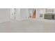 Open basement with neutral carpet and white trim, providing a blank canvas for a variety of uses at 6620 S Foresthill St, Littleton, CO 80120