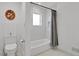 Bright bathroom features a modern tiled shower, elegant fixtures, and a stylish, neutral palette at 6620 S Foresthill St, Littleton, CO 80120