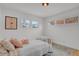 A calm bedroom space is furnished with soft textures and natural light enhancing the cozy atmosphere at 6620 S Foresthill St, Littleton, CO 80120