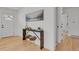 Inviting entryway boasts a stylish console table, decorative art, and an abundance of natural light at 6620 S Foresthill St, Littleton, CO 80120