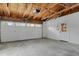 Spacious garage with ample storage, an automatic door opener, and a separate entry door at 6620 S Foresthill St, Littleton, CO 80120