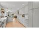 Open-concept kitchen with modern appliances, custom cabinetry, and seamless flow to living area at 6620 S Foresthill St, Littleton, CO 80120