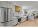 Well-equipped kitchen with stainless steel appliances, ample counter space, and modern design at 6620 S Foresthill St, Littleton, CO 80120