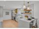 Stylish kitchen featuring quartz countertops, stainless steel appliances, and custom shelving at 6620 S Foresthill St, Littleton, CO 80120