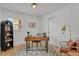 Well-lit home office with a modern desk, comfortable seating, and ample natural light for productivity at 6620 S Foresthill St, Littleton, CO 80120