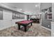 Finished basement with red pool table, bar with stools, recessed lighting, and neutral carpet at 6445 S Telluride St, Aurora, CO 80016