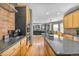 Open concept kitchen featuring stainless appliances, granite countertops, and seamless flow into the living space at 6445 S Telluride St, Aurora, CO 80016