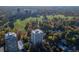 An aerial shot of the high-rise apartment building surrounded by lush greenery, showcasing the property's location and neighborhood at 1200 N Humboldt St # 101, Denver, CO 80218
