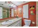 Bathroom with a granite countertop vanity and a framed mirror at 1200 N Humboldt St # 101, Denver, CO 80218