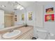 Bright bathroom featuring a single sink vanity, decorative art, and updated fixtures at 1200 N Humboldt St # 101, Denver, CO 80218