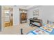 Bedroom featuring a keyboard, armoire, and view to the ensuite bathroom at 1200 N Humboldt St # 101, Denver, CO 80218