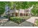 The building's entrance is beautifully landscaped with well-maintained flower beds and ornate architectural details and ironwork at 1200 N Humboldt St # 101, Denver, CO 80218