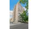 An impressive high-rise apartment building shows off continuous balconies and elegant design, offering scenic views at 1200 N Humboldt St # 101, Denver, CO 80218