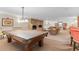 Recreational game room featuring a billiards table, fireplace, and comfortable seating areas at 1200 N Humboldt St # 101, Denver, CO 80218