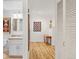 View from hallway into updated bathroom featuring a single sink vanity at 1200 N Humboldt St # 101, Denver, CO 80218