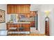 Inviting kitchen with wood breakfast bar and stainless steel appliances at 1200 N Humboldt St # 101, Denver, CO 80218