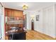 Charming kitchen featuring wood cabinets and dining area at 1200 N Humboldt St # 101, Denver, CO 80218