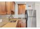 Updated kitchen with stainless steel appliances and custom cabinets at 1200 N Humboldt St # 101, Denver, CO 80218