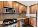Kitchen area with modern stainless steel appliances and cabinetry at 1200 N Humboldt St # 101, Denver, CO 80218