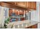 Bright kitchen with wood cabinets, granite countertops, modern appliances, and ample counter space at 1200 N Humboldt St # 101, Denver, CO 80218