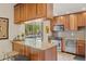 Well-appointed kitchen bar area with modern appliances and fixtures at 1200 N Humboldt St # 101, Denver, CO 80218