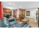 Inviting living room featuring hardwood floors, a comfortable leather couch, and vintage furniture at 1200 N Humboldt St # 101, Denver, CO 80218