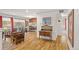 Bright, open-concept living room and dining area with hardwood floors at 1200 N Humboldt St # 101, Denver, CO 80218