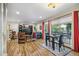 Bright living room featuring a large window, dining area, and stylish furnishings at 1200 N Humboldt St # 101, Denver, CO 80218