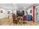 Comfortable living room with wood floors, decorative shelving, comfortable seating, and natural light at 1200 N Humboldt St # 101, Denver, CO 80218