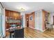 Open living space with warm wood floors, storage closets, eat-in area, and lots of natural light at 1200 N Humboldt St # 101, Denver, CO 80218