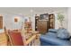 Comfortable living room features hardwood floors, and a cozy seating area with a blue sofa and craftsman furniture at 1200 N Humboldt St # 101, Denver, CO 80218