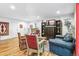 Cozy living room with wood floors, classic decor, comfortable seating, and plenty of natural light at 1200 N Humboldt St # 101, Denver, CO 80218