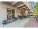 Inviting outdoor patio with seating, potted plants, and secure sliding door, perfect for relaxing and enjoying fresh air at 1200 N Humboldt St # 101, Denver, CO 80218