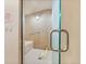 Inviting steam room featuring tiled walls, seating, accessible grab bar, and glass door at 1200 N Humboldt St # 101, Denver, CO 80218