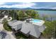 An aerial view showing community pool, lake, and lush landscaping at 5394 S Gray St, Littleton, CO 80123