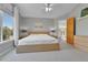 Main bedroom with carpet, neutral walls, a large window, and ensuite bathroom at 5394 S Gray St, Littleton, CO 80123