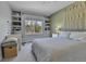 Cozy bedroom featuring bright window, stylish decor, and comfortable furnishings at 5394 S Gray St, Littleton, CO 80123