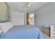 Comfortable bedroom featuring closet, blue bedding, and natural light at 5394 S Gray St, Littleton, CO 80123