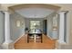 Elegant dining room features hardwood floors, modern lighting, and backyard views at 5394 S Gray St, Littleton, CO 80123