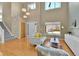 Bright and airy living room with vaulted ceiling, hardwood floors, and large windows at 5394 S Gray St, Littleton, CO 80123
